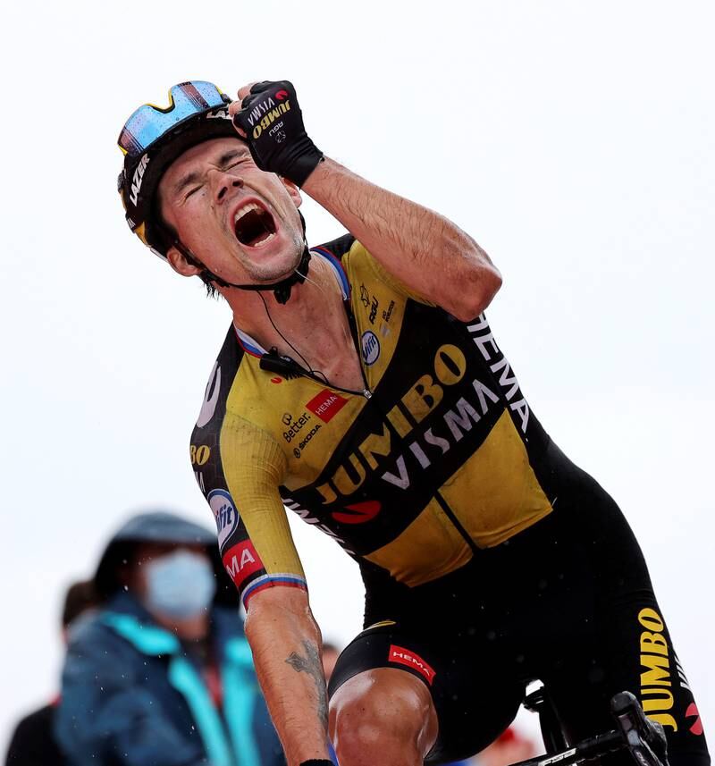 Team Jumbo-Visma rider Primoz Roglic celebrates after winning Stage 17 of La Vuelta - a 185. 8km stage between Unquera and Lagos de Covadonga in Spain - on Wednesday, September 1.   EPA