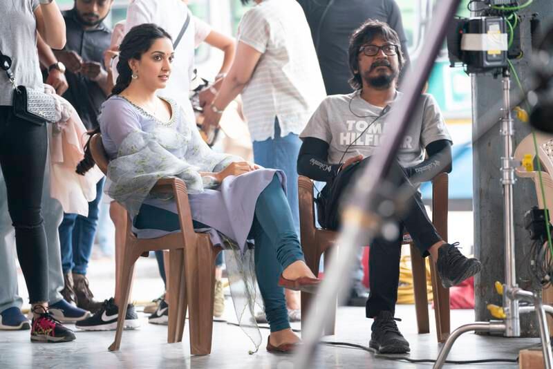 Kiara Advani, left, with 'Shershaah' director Vishnu Vardhan on the film's set.