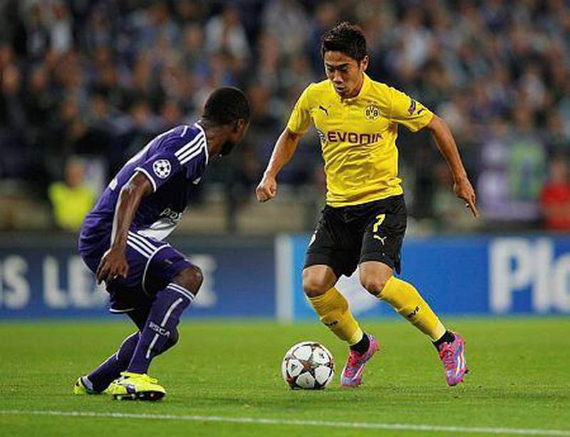 Shinji Kagawa, right, of Borussia Dortmund takes on Chancel Mbemba of Anderlecht during the Uefa Champions League Group D match against RSC Anderlecht at Constant Vanden Stock Stadium on October 1, 2014 in Anderlecht, Belgium. Dean Mouhtaropoulos/Getty Images