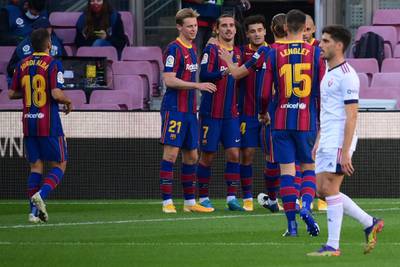 Barcelona's midfielder Philippe Coutinho celebrates his goal with teammates at the Camp Nou. AFP