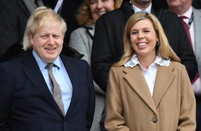 epa08390710 (FILE) British Prime Minister, Boris Johnson (L) and his partner Carrie Symonds (R) during the Six Nations rugby match between England and Wales held at Twickenham stadium in London, Britain, 07 March 2020 (reissued 29 April 2020). British Prime Minister Boris Johnson and his partner Carrie Symonds announced on 29 April 2020 the birth of their baby son.  EPA/FACUNDO ARRIZABALAGA *** Local Caption *** 55935636