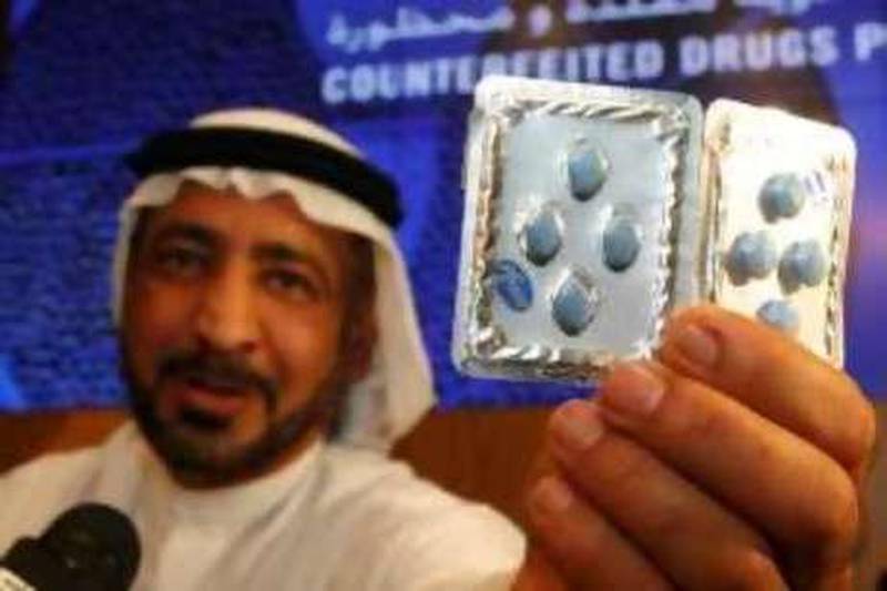 Dubai, 31st May 2010.  Ahmed Butti Ahmed (Director General, Dubai Customs)  shows the genuine and counterfeit drugs, during the press conference, held at the Dubai Customs headquarters.  (Jeffrey E Biteng / The National)  Editor's Note;  Ahmed Butti Ahmed invited one of the media reporter to see which one is fake of the two packs.