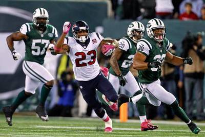 Houston Texans' running back Arian Foster rushes the New York Jets