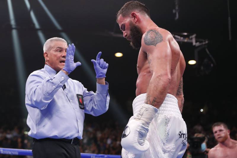 Referee Russell Mora gives Caleb Plant a standing count. AP Photo