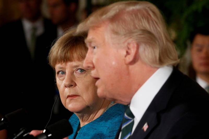 FILE PHOTO: Germany's Chancellor Angela Merkel and U.S. President Donald Trump hold a joint news conference in the East Room of the White House in Washington, U.S., March 17, 2017. REUTERS/Jonathan Ernst/File Photo