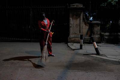 Lillian sweeping the empty streets of the CBD in Nairobi. AFP