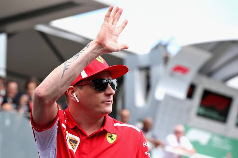 SAO PAULO, BRAZIL - NOVEMBER 11: Kimi Raikkonen of Finland and Ferrari waves to the crowd on the drivers parade before the Formula One Grand Prix of Brazil at Autodromo Jose Carlos Pace on November 11, 2018 in Sao Paulo, Brazil.  (Photo by Charles Coates/Getty Images)