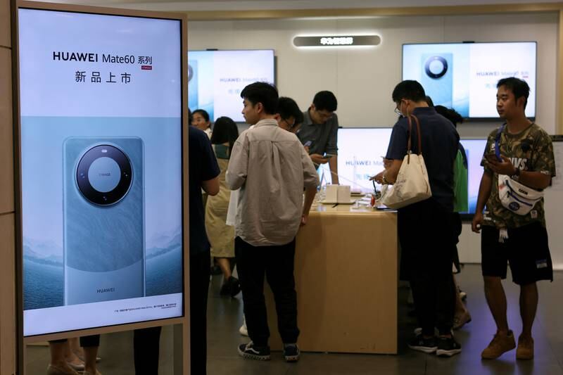 A Huawei store with advertisements for the Mate 60 series smartphones, at a shopping mall in Beijing. Reuters 