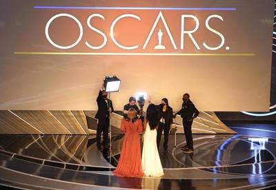 Serena and sister Venus Williams introduce a performance by Beyonce at the Oscars.  AP
