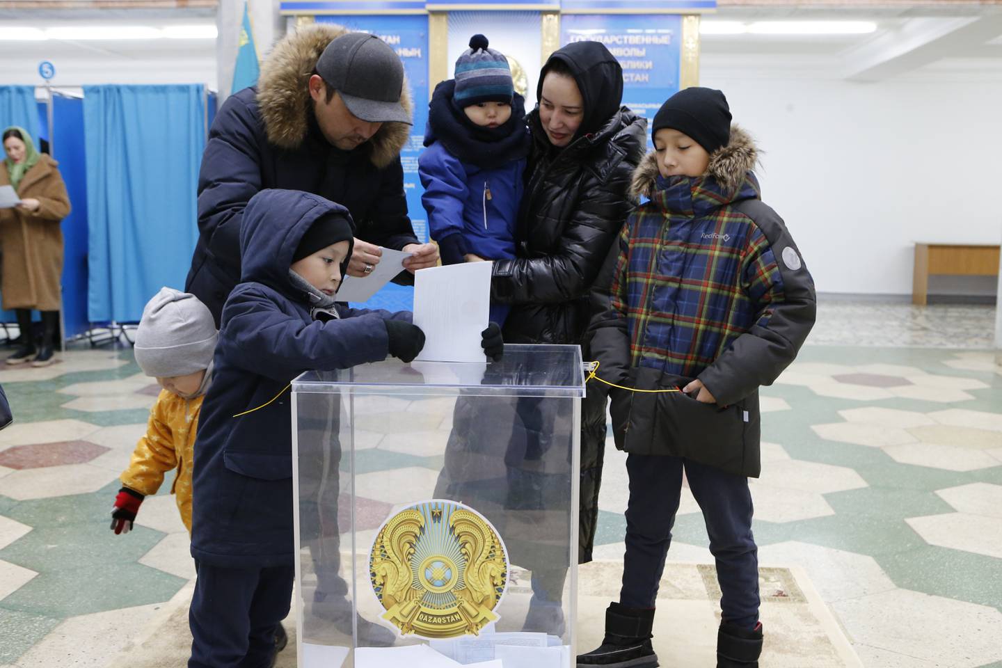 A family at a polling station in Astana, Kazakhstan, on Sunday. AP