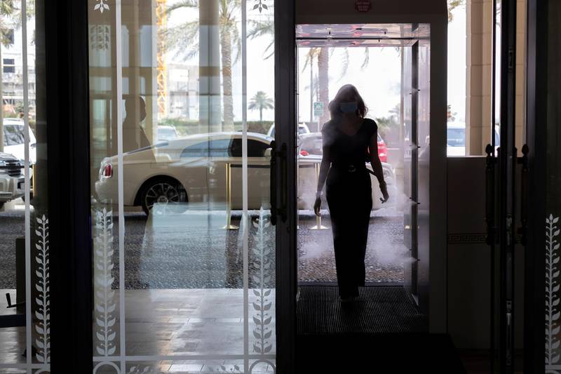 Dubai, United Arab Emirates - Reporter: N/A. Coronavirus/Covid-19. A lady walks through the disinfection booth at the Palazzo Versace hotel. Sunday, June 7th, 2020. Dubai. Chris Whiteoak / The National