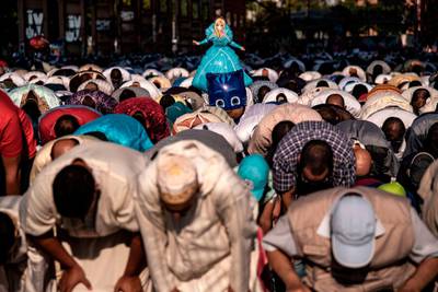 Muslims attend a morning prayer at the industrial wasteland of Parco Dora in Turin on the first day the Eid al-Adha. AFP