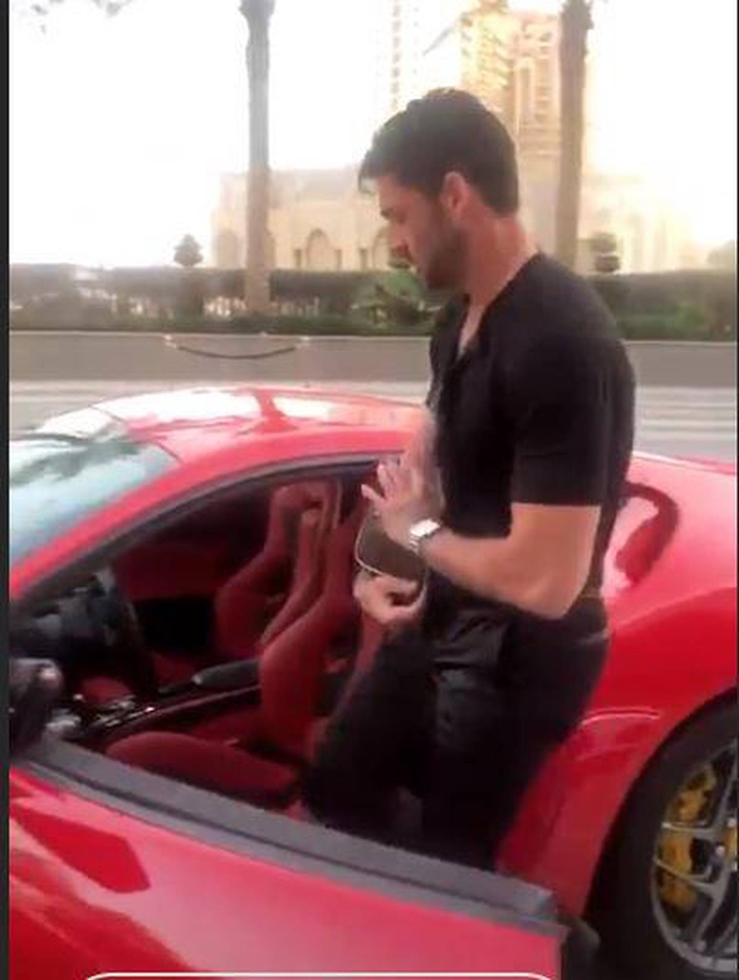 Michele Morrone shared a video of himself behind the wheel of a red Ferrari. Instagram / Michele Morrone