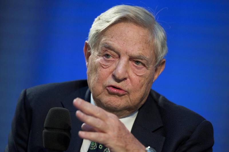 FILE PHOTO: Soros Fund Management Chairman George Soros speaks during a panel discussion at the Nicolas Berggruen Conference in Berlin, October 30, 2012. REUTERS/Thomas Peter/File Photo