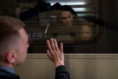 Ukrainian Nicolai, 41, says goodbye to his daughter Elina, 4, and his wife Lolita, on a train bound for Poland fleeing from the war at the train station in Lviv, western Ukraine. AP Photo