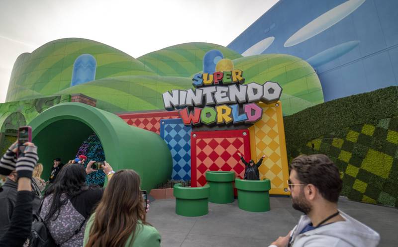 Guests queue to enter Super Nintendo World. Bloomberg