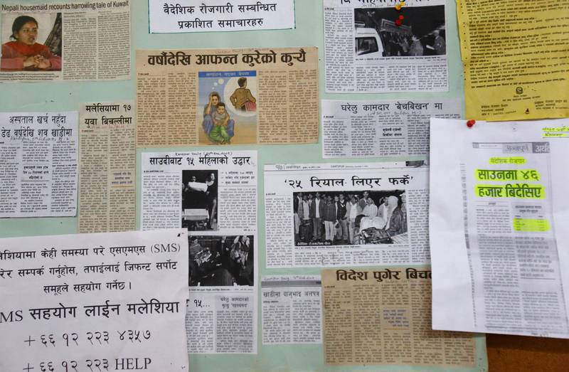 Newspaper clippings on foreign employment and the Nepalis' plights while working abroad are posted on a notice board at the Foreign Employment Promotion Board in Kathmandu October 1, 2013. At least 400,000 Nepalis are expected to leave this year for jobs in construction and as domestic workers in the Gulf and Malaysia. The treatment of Nepalis building World Cup football stadia in Qatar has come under scrutiny after a report by the British newspaper the Guardian that dozens had died on building sites between early June and early August. The deaths in Qatar, as well as in Malaysia and Saudi Arabia, have shone a light on the huge migration from the landlocked Himalayan nation that got going during a 10-year civil war and has only accelerated since. At the Foreign Employment Promotion Board in Kathmandu on Tuesday, half a dozen bereaved families and widows sought government compensation for the deaths of relatives overseas. Picture taken October 1, 2013. To match Feature NEPAL-WORKERS/   REUTERS/Navesh Chitrakar (NEPAL - Tags: SOCIETY BUSINESS CONSTRUCTION EMPLOYMENT POVERTY) - RTR3FLHP