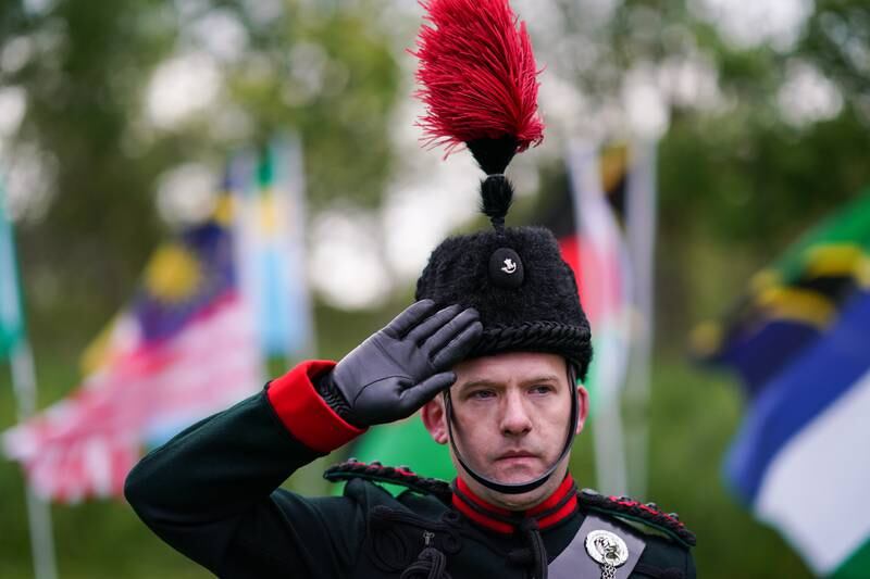 Bugler Captain Jonathan Miller from Durham Army Cadet Force salutes during Queen Elizabeth II’s platinum jubilee beacon lighting ceremony at Cawfield Quarry on Hadrian’s Wall on June 02, 2022 in Haltwhistle, England. Getty