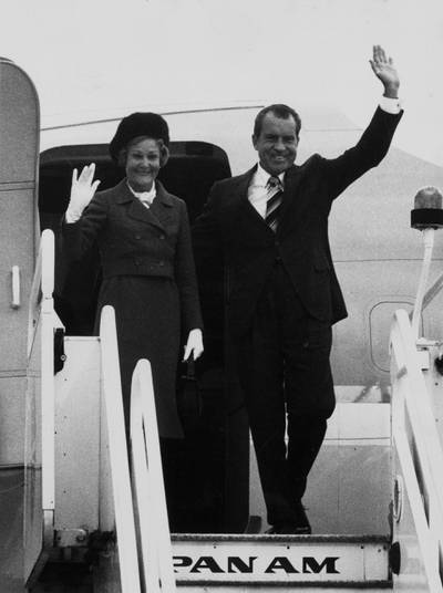 30th October 1970:  American President Richard Nixon and his wife Pat wave as they step off the Air Force One presidential aircraft after landing at Heathrow Airport, London, for a one-day visit to Britain.  (Photo by Evening Standard/Getty Images)