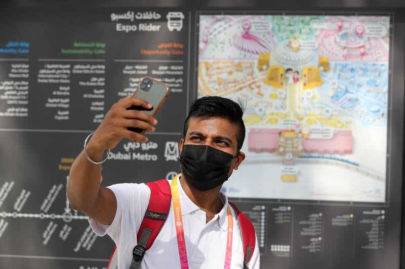 Nitin Nishant takes a selfie in front of the Expo map. Chris Whiteoak / The National