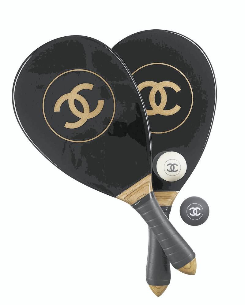 State of play: Chanel knocks it out of the park again with this wood and resin beach bat and ball set, priced at about Dh10,000. Courtesy Chanel
