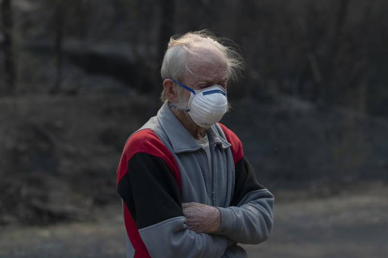 Andrew Mackenzie is pictured while surveying the damage around his home due to the Gulf Road fire that tore through the small community of Torrington. By chance his home was spared, though his neighbours house burnt to the ground. Andrew ran to a nearby creek, watching as the area burned.  A deeply religious man, Andrew prayed. I thought that was it, he said. Getty Images