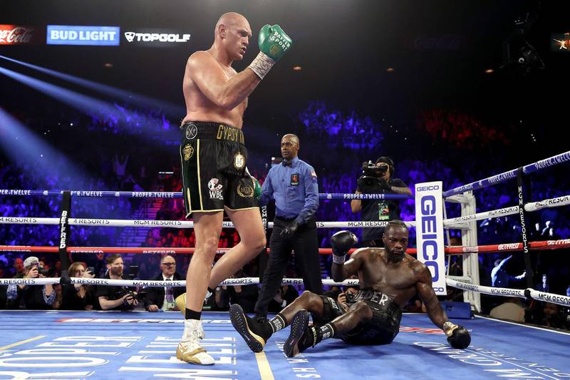 Tyson Fury knocks down Deontay Wilder in the fifth round.