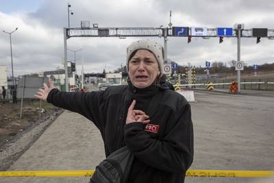 Hanna Pavlovna Lukasz, from Mirhord, Ukraine, said her sons, aged 12 and 8, and her 66-year-old mother had been waiting on the Ukrainian side of the border crossing with Medyka, Poland, for four days. AP