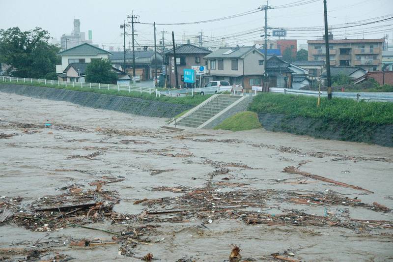 Rising water caused by heavy rain is seen at Kuma river in Yatsushiro, Kumamoto prefecture. AFP