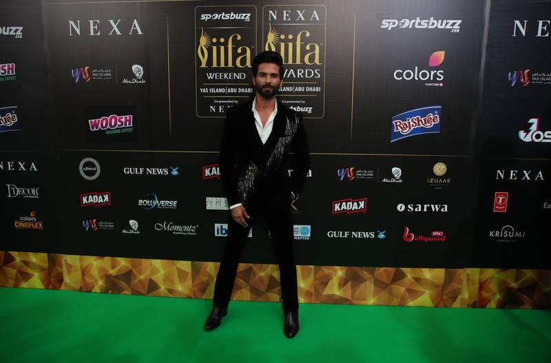 Shahid Kapoor sports a touch of sparkle on his tuxedo jacket. EPA 