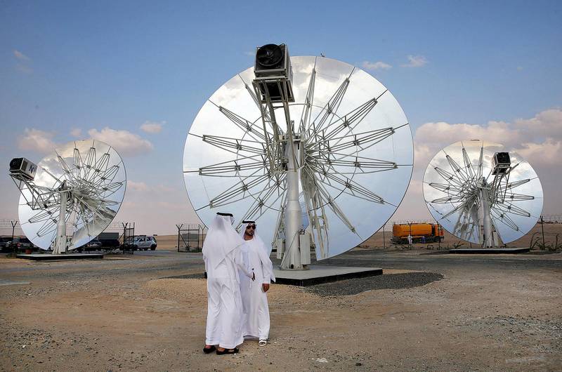 Men stand in front of solar panels at the Mohammed bin Rashid Al Maktoum Solar Park in Dubai, November 28, 2015. REUTERS/Stringer *** Local Caption ***  GAZ06_EMIRATES-ENER_1128_11.JPG BZ05ap-PG2_SOLAR.jpg