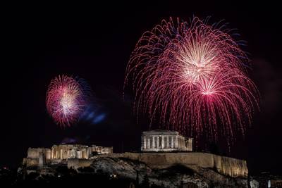 Fireworks explode over the ancient Parthenon temple atop the Acropolis hill during New Year's in Athens, Greece. Reuters