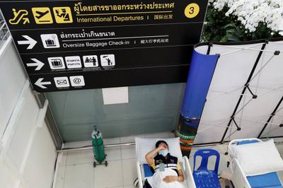 A person recovers after a reaction following vaccination against Covid-19 at Suvarnabhumi airport in Bangkok, Thailand. Reuters