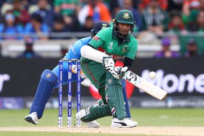 BIRMINGHAM, ENGLAND - JULY 02: Shakib Al Hasan of Bangladesh scoops a shot to the legside as India wicketkeeper Rishabh Pant looks on during the Group Stage match of the ICC Cricket World Cup 2019 between Bangladesh and India at Edgbaston on July 02, 2019 in Birmingham, England. (Photo by Michael Steele/Getty Images)