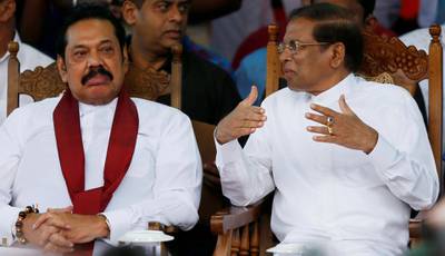 FILE PHOTO: Sri Lanka's newly appointed Prime Minister Mahinda Rajapaksa and President Maithripala Sirisena talk during a rally near the parliament in Colombo, Sri Lanka November 5, 2018. REUTERS/Dinuka Liyanawatte/File Photo