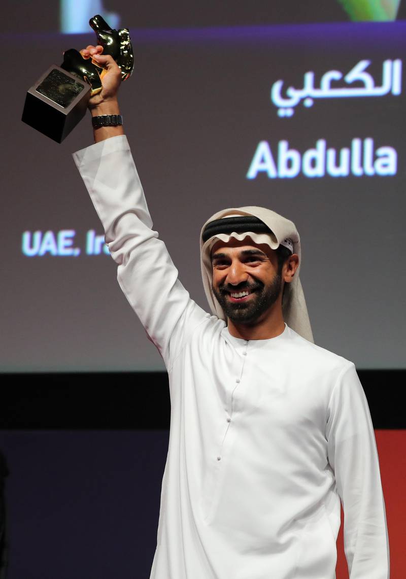 DUBAI, UNITED ARAB EMIRATES - DECEMBER 14:  Abdulla Al Kaabi with the Muhr Emirati Best Feature award for "Al-Rijal Faqat End Al-Dafn (Only Men Go To The Grave)" during the Muhr Awards on day eight of the 13th annual Dubai International Film Festival held at the Madinat Jumeriah Complex on December 14, 2016 in Dubai, United Arab Emirates.  (Photo by Neilson Barnard/Getty Images for DIFF) *** Local Caption *** Abdulla Al Kaabi