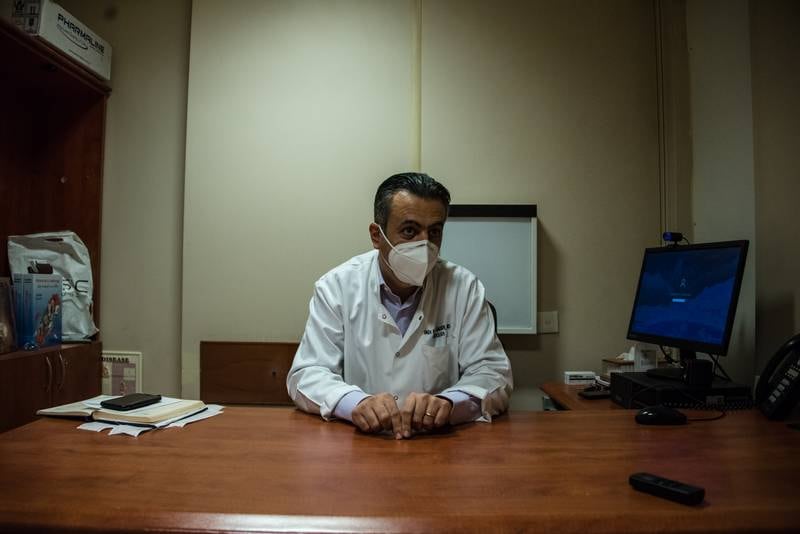Cardiologist Dr Fadi Abou Jaoude in his office at St George's Hospital. Doctors who choose to stay in Lebanon say the feeling of responsibility towards their patients outweighs other struggles.