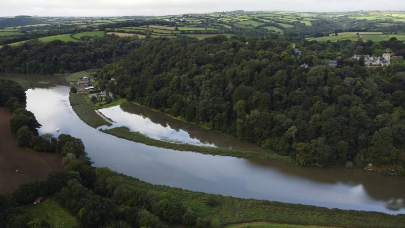 The site was flooded after a breach was created in the bank of the River Tamar at Cotehele, Cornwall. Photo: PA