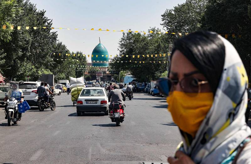 A mask-clad Iranian woman crosses a street in the capital Tehran, on June 20, 2021. Iran's ultraconservatives hailed the election victory of their candidate Ebrahim Raisi, after Washington charged the vote was unfair and Tehran's arch-foe Israel labelled him the "most extremist" president yet.
Raisi, 60, won this week's election in which more than half the voters stayed away after many political heavyweights had been barred from running and as an economic crisis driven by US sanctions has battered the country.
 / AFP / Atta KENARE

