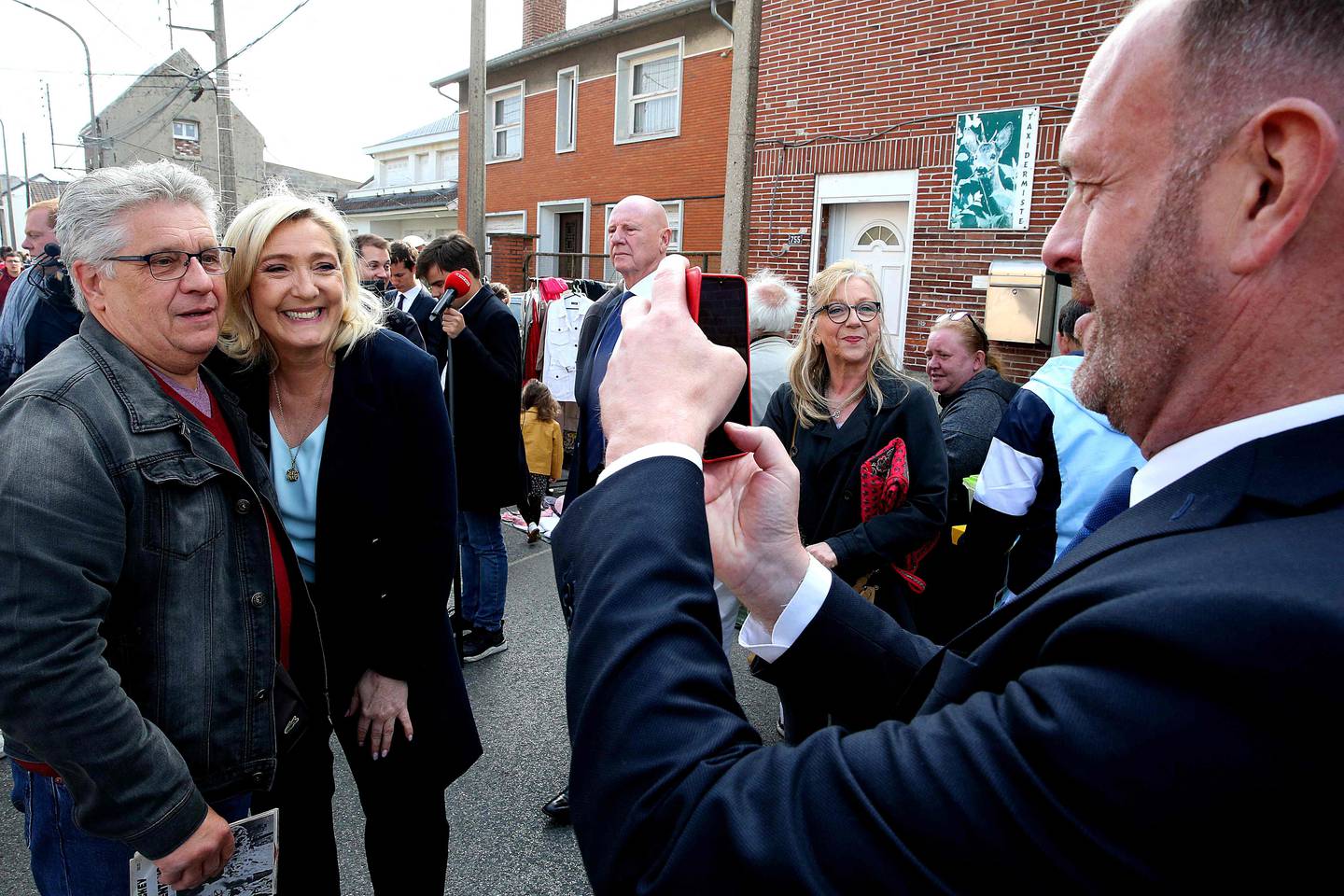 Marine Le Pen, in the center, is Emmanuel Macron's most formidable opponent.  AFP