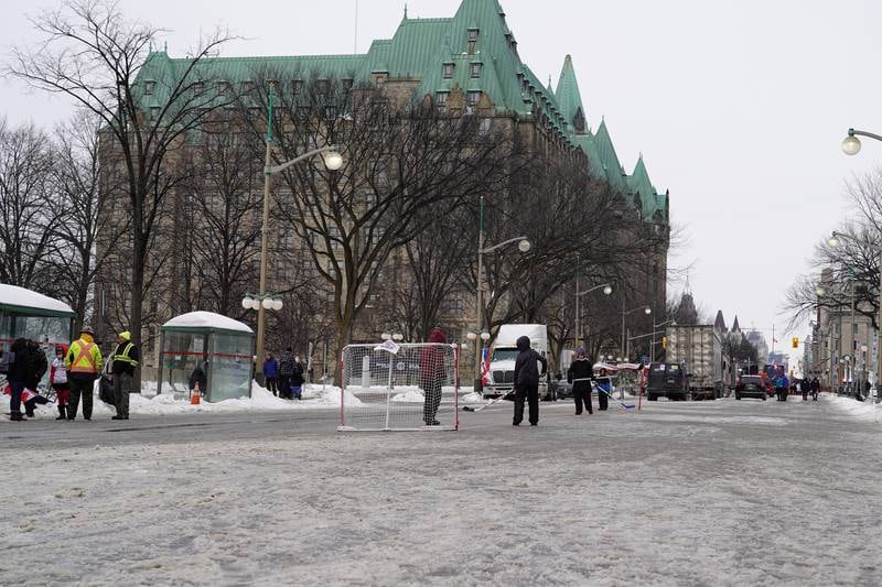 Children play hockey on the street in front of the Canadian Parliament. Willy Lowry / The National