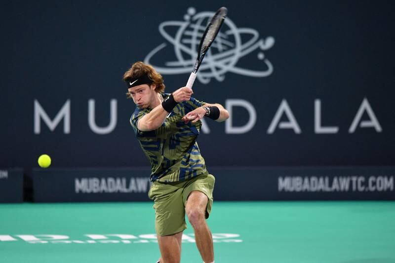 Andrey Rublev hits a forehand to Borna Coric during their quarter-final match at the Mubadala World Tennis Championship at the International Tennis Centre in Abu Dhabi on December 16, 2022. AFP