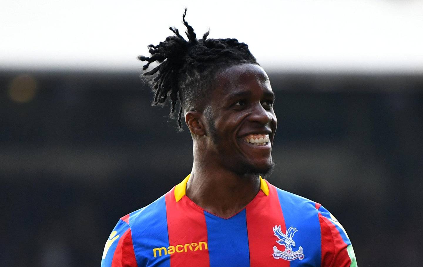 Soccer Football - Premier League - Crystal Palace vs Brighton & Hove Albion - Selhurst Park, London, Britain - April 14, 2018   Crystal Palace's Wilfried Zaha celebrates after the match    REUTERS/Dylan Martinez    EDITORIAL USE ONLY. No use with unauthorized audio, video, data, fixture lists, club/league logos or "live" services. Online in-match use limited to 75 images, no video emulation. No use in betting, games or single club/league/player publications.  Please contact your account representative for further details.