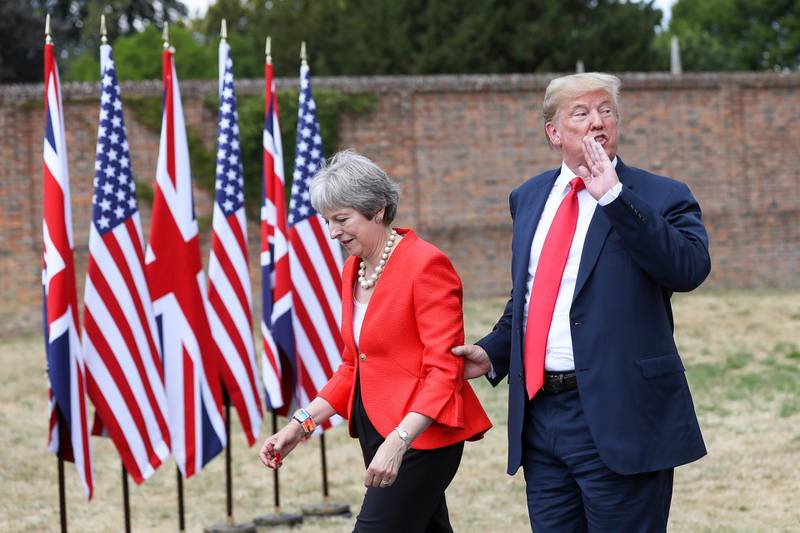 FILE: U.S. President Donald Trump, speaks to the media as he holds onto Theresa May, U.K. prime minister, following their joint news conference at Chequers in Aylesbury, U.K., on Friday, July 13, 2018. An emotional Theresa May announced she will quit as Britain’s prime minister after admitting she had failed to deliver the one task that defined her time in office -- taking the country out of the European Union. Photographer: Chris Ratcliffe/Bloomberg