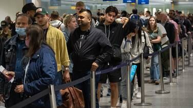 Travellers queue to pass through the security check at Heathrow in summer 2022. Getty Images