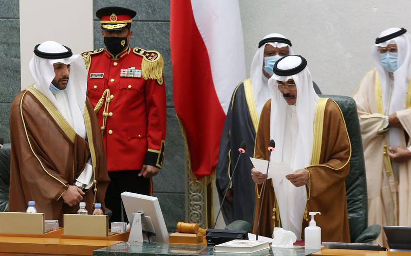 Sheikh Nawaf Al Sabah, second from right, reads a statement after being sworn in as Kuwait's new Emir.  AFP