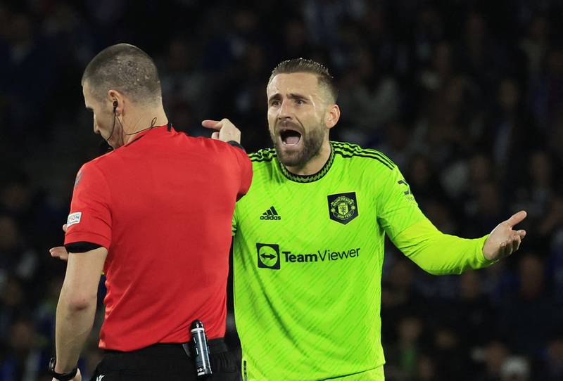 United's Luke Shaw argues with referee Georgi Kabakov. Reuters