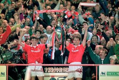 Manchester United captain Steve Bruce and Bryan Robson hold aloft the FA Premier League trophy after the final home game of the 1992-93 season, when they finished as champions with  84 points. Getty