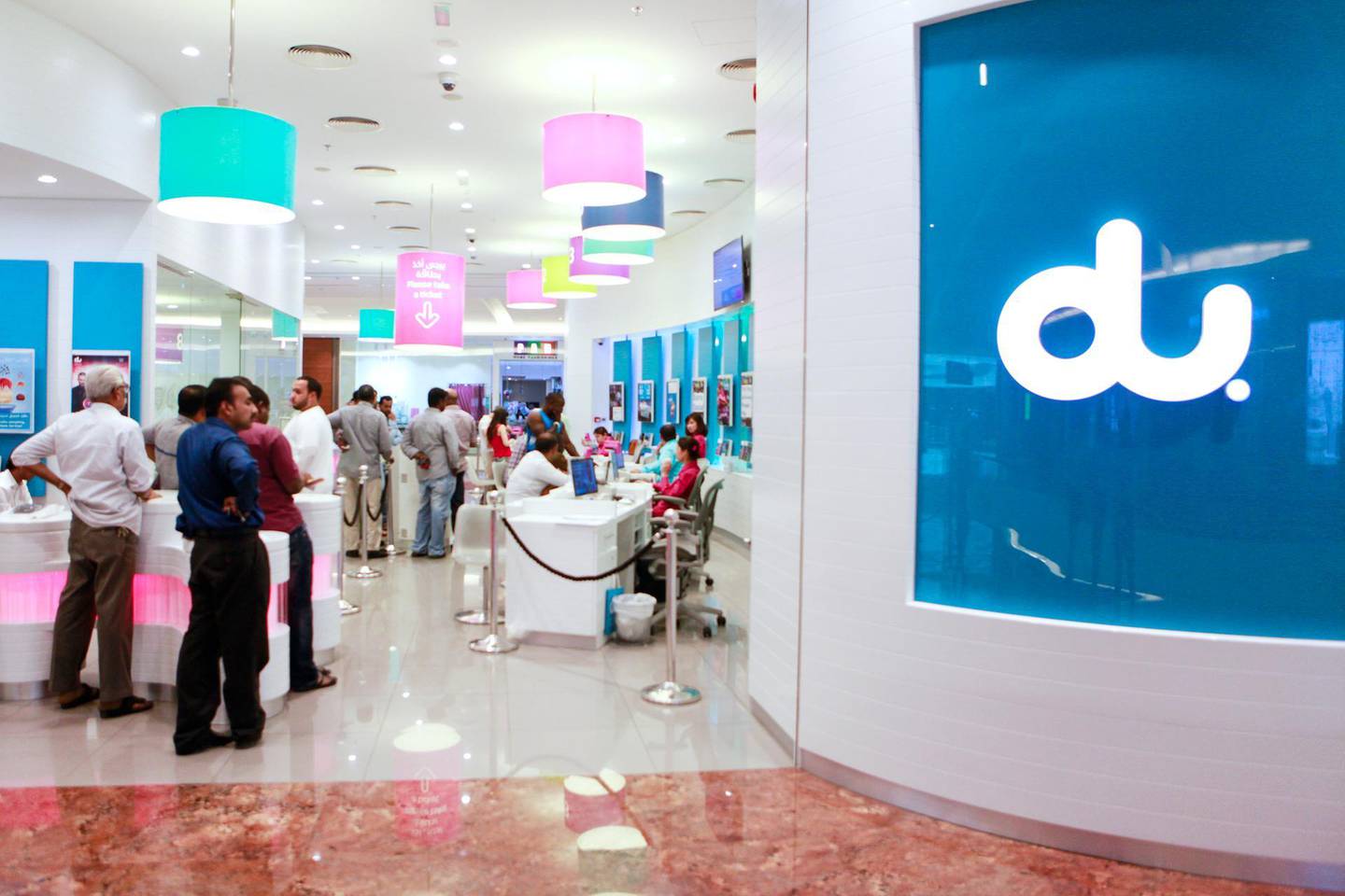 DUBAI, UAE. April 19, 2015 - Stock photograph of customers queuing at the Du store in Al Ghurair Center in Dubai, April 19, 2015. (Photos by: Sarah Dea/The National, Story by: Standalone, Stock) *** Local Caption ***  SDEA190415-du_stock02.JPG
