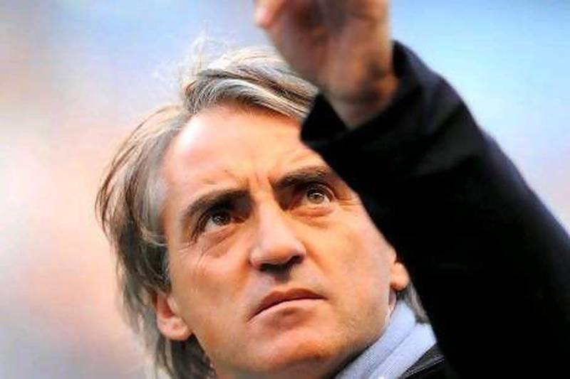 Roberto Mancini manager of Manchester City points .Barclays Premier League match between Manchester City v Manchester Utd at the Etihad Stadium, Manchester on the 30th April 2012. Simon Bellis / ZUMA Press)